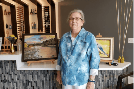Arbor Terrace Hamilton Mill Resident and her painting
