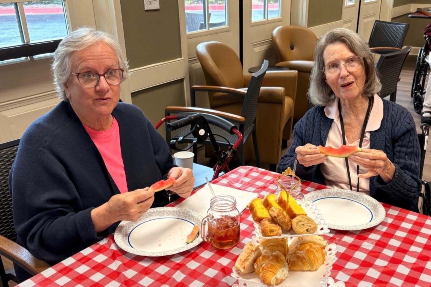 Residents sharing a meal together at our senior living community in Acworth, GA, part of our engaging senior lifestyle programs