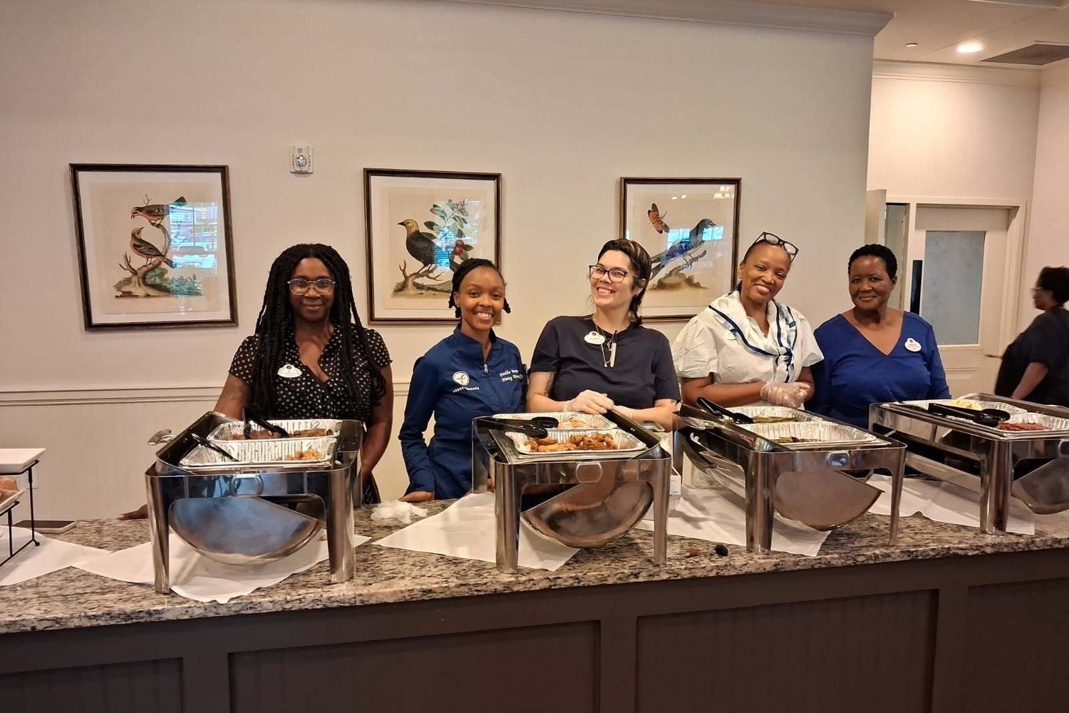 Staff team preparing a dining service at our senior living community in Acworth, GA, part of our resort-style senior amenities and culinary offerings