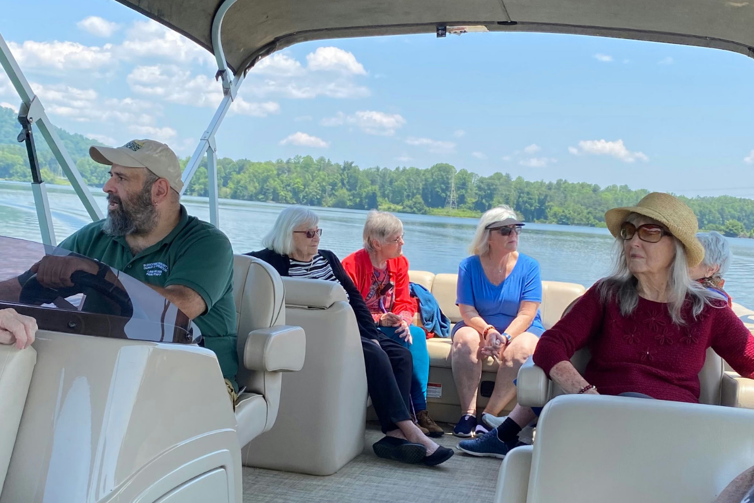 Senior residents on a day out on a boat ride during a sunny day