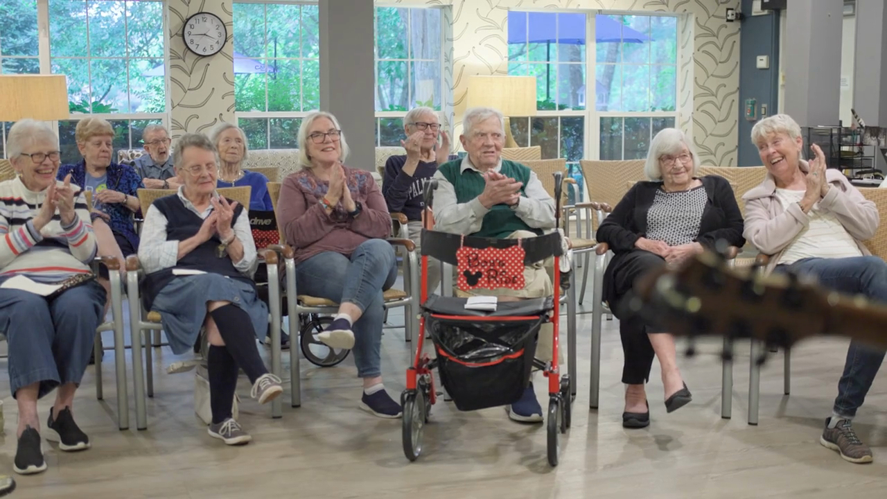 asheville - senior residents smiling and clapping