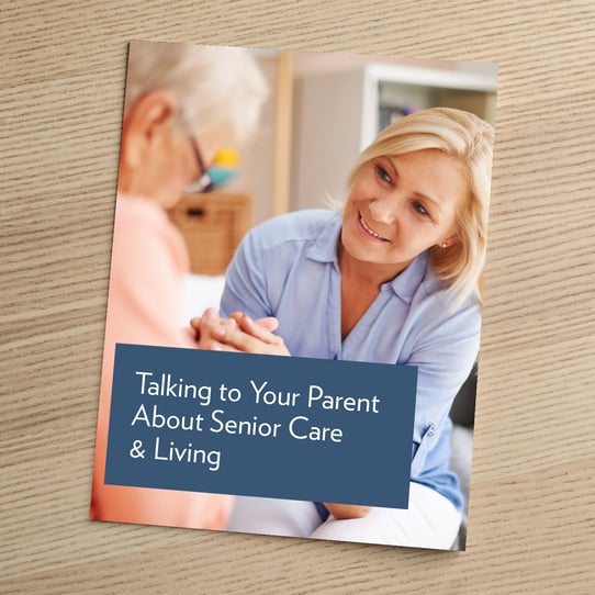 Cover of a brochure titled "Talking to Your Parent About Senior Care &amp; Living," featuring a smiling middle-aged woman holding the hands of an elderly person in a warm, caring interaction.