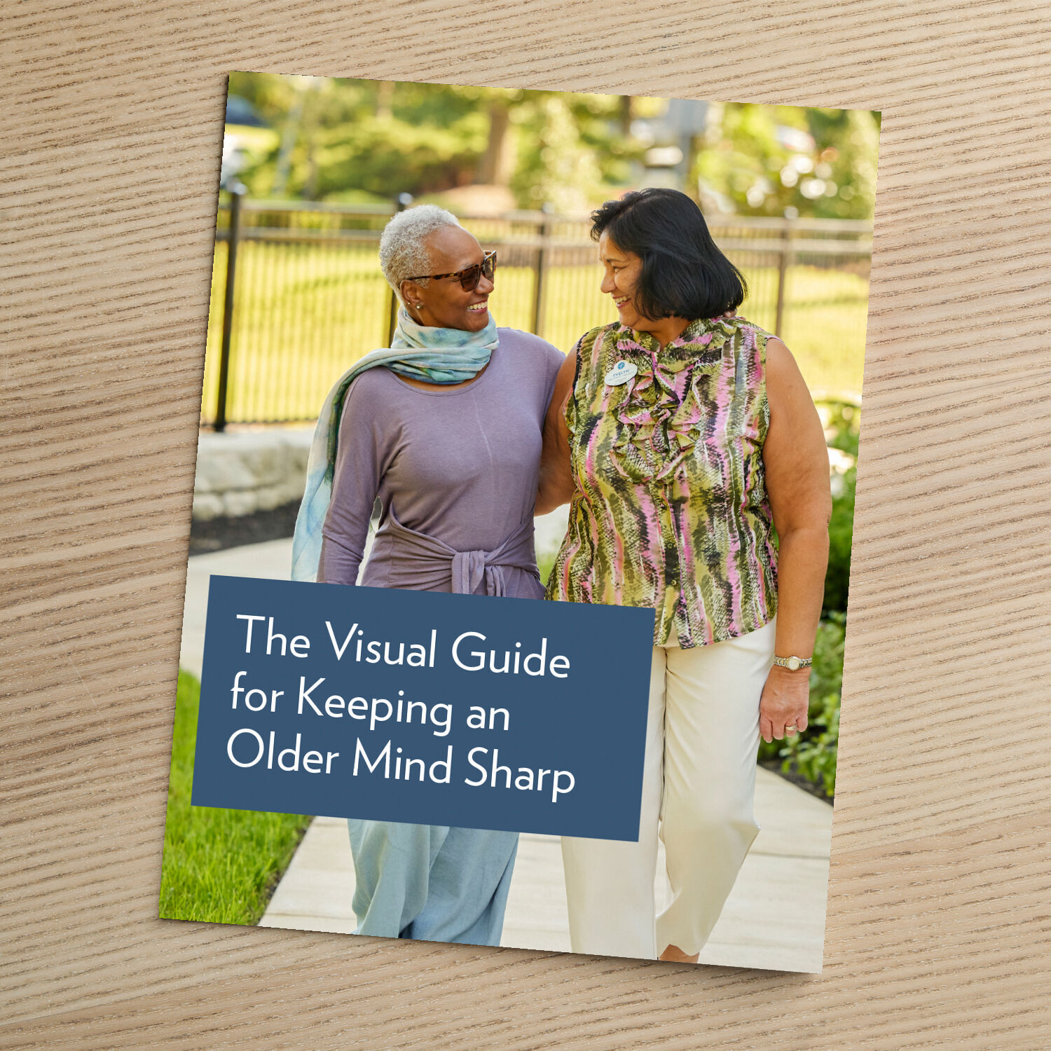 Cover of "The Visual Guide for Keeping an Older Mind Sharp," featuring two older women walking together and smiling at each other outside.