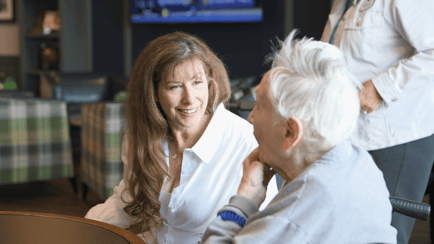 resident and staff talking