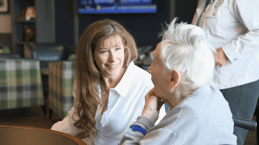 resident and staff talking