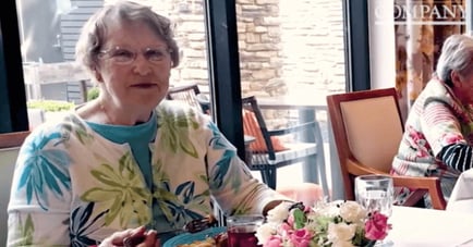 a senior lady enjoying her meal