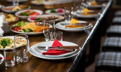 A vibrant spread of dining dishes along Atlantic Avenue in Delray Beach, a lively destination for dining and community events near this senior living community in Lake Worth, FL.