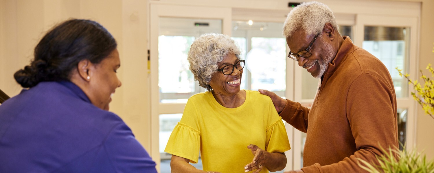 TheArborCompany_ConcerigeHelpingSeniorCouple