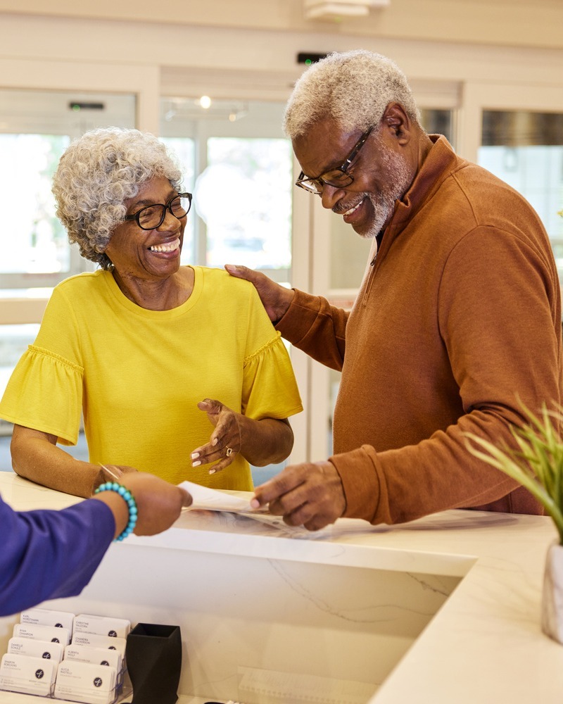 TheArborCompany_ConcerigeHelpingSeniorCouple