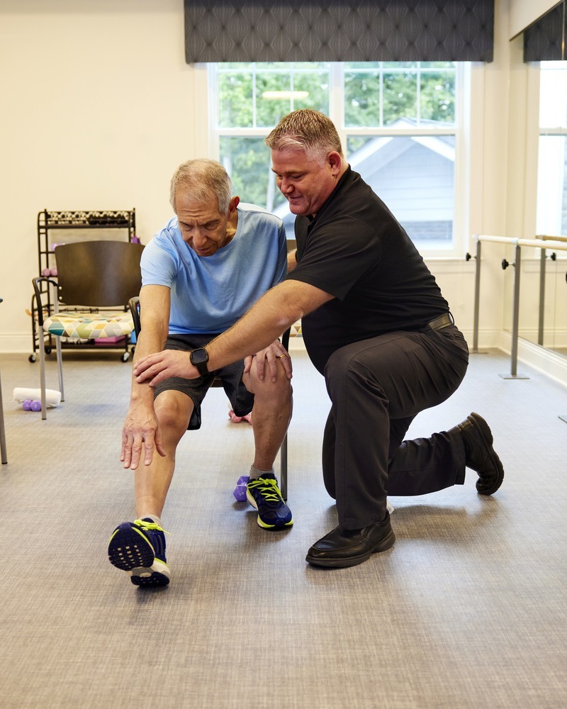 TheArborCompany_PhysicalTherapistAndSeniorManStretching