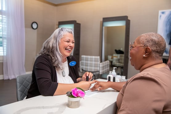 Staff member giving resident a manicure