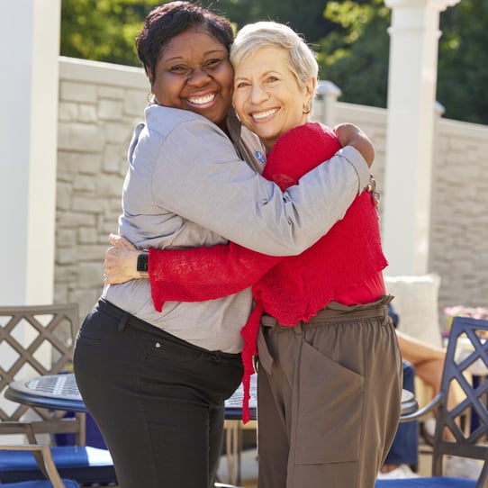 TheArborCompany_SeniorAndEmployeeHugging (1)