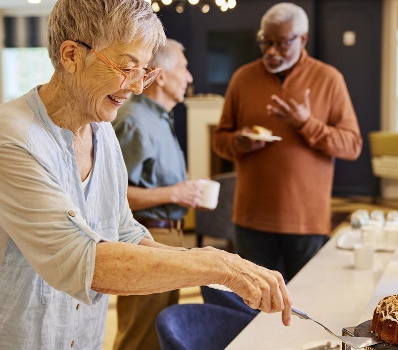 TheArborCompany_SeniorWomanGettingPastry-1-1