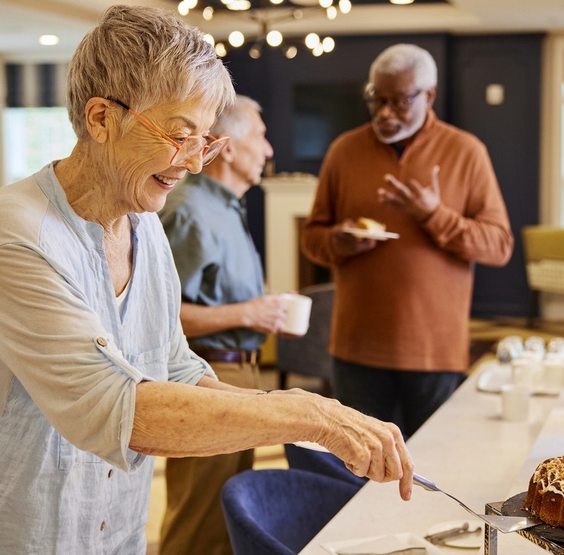 TheArborCompany_SeniorWomanGettingPastry-1