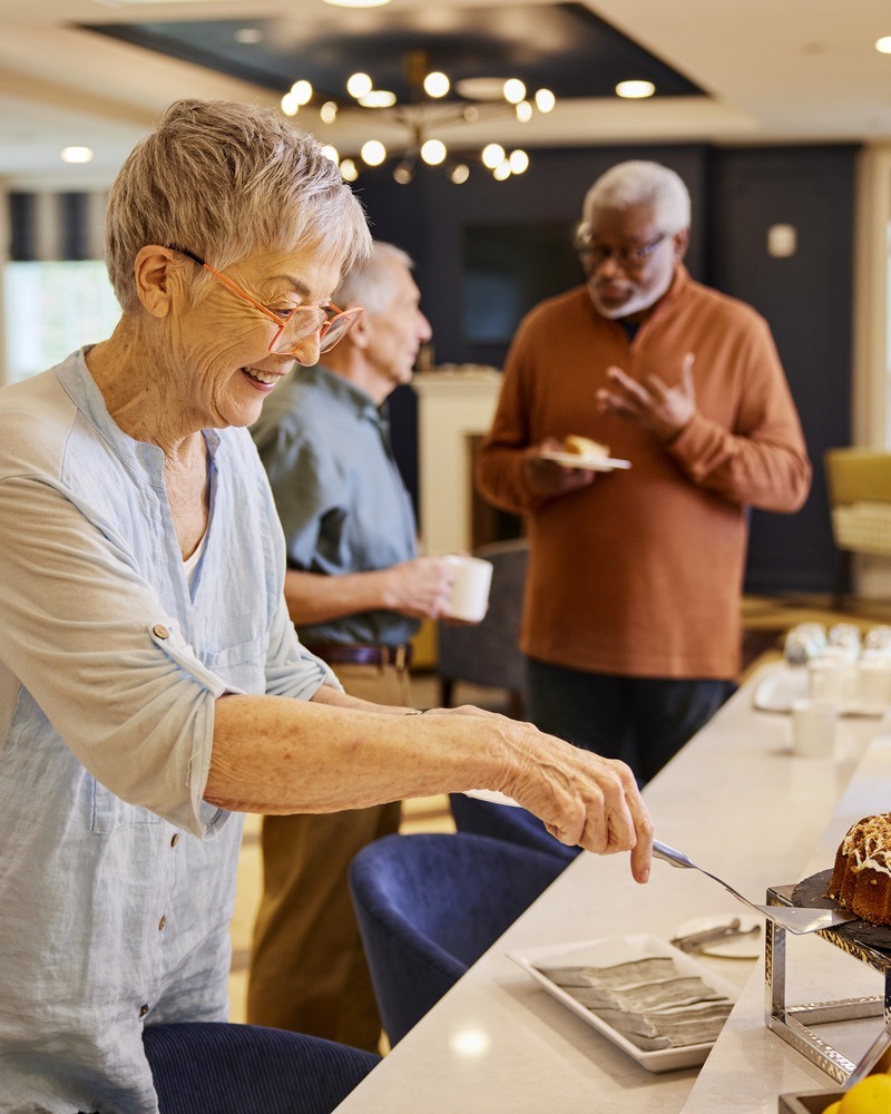 TheArborCompany_SeniorWomanGettingPastry