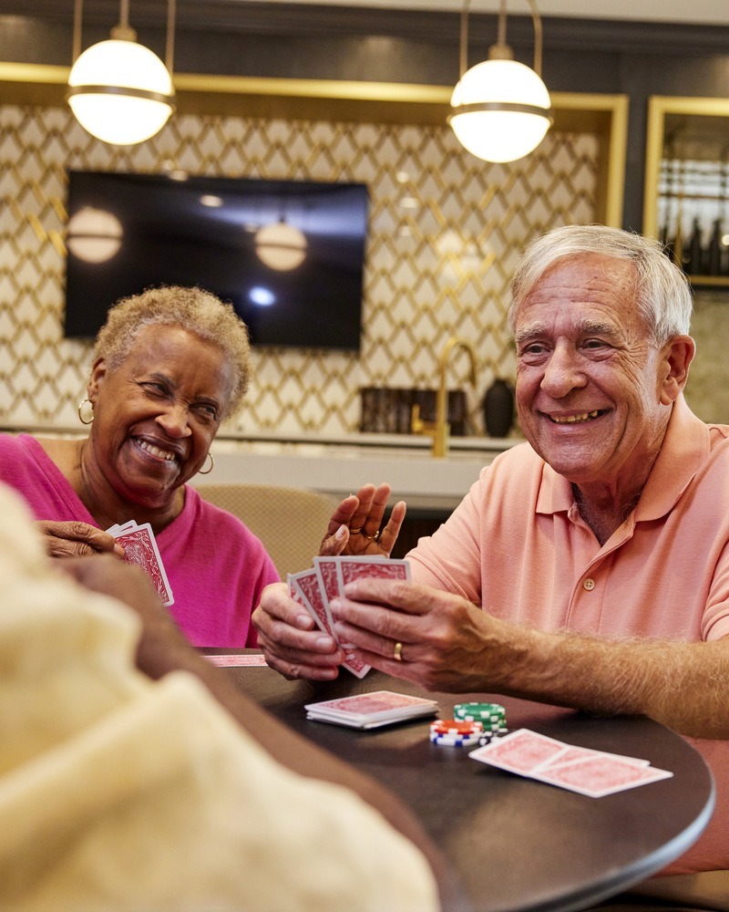 TheArborCompany_SeniorsPlayingCardsLaughing-1
