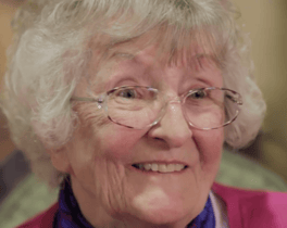 A warm and happy resident smiles brightly at this assisted living community in Shrewsbury NJ, reflecting the caring, person-centered atmosphere and genuine joy of everyday life in Monmouth County senior living.