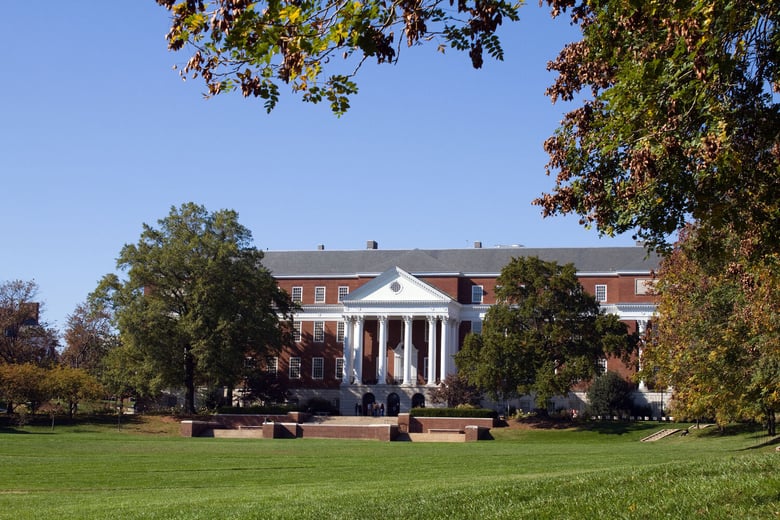 The University of Maryland's stately campus buildings surrounded by mature trees in College Park, just a short drive from this active senior living community in Lanham, MD.
