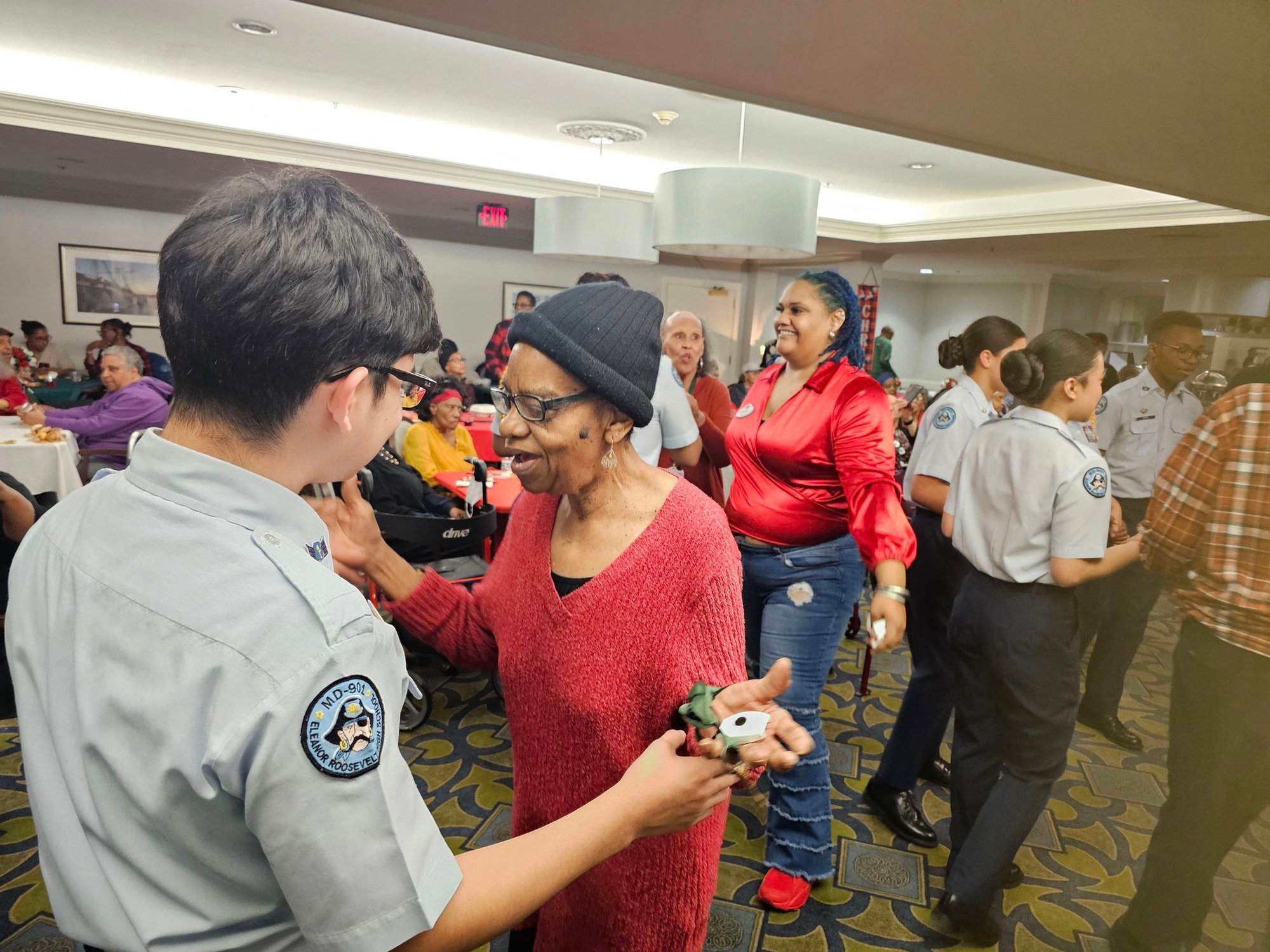 A lively community event at Arbor Terrace Senior Living in Lanham, MD, where residents and visitors mingle and enjoy social activities together, reflecting the vibrant senior living experience near Greenbelt, MD.