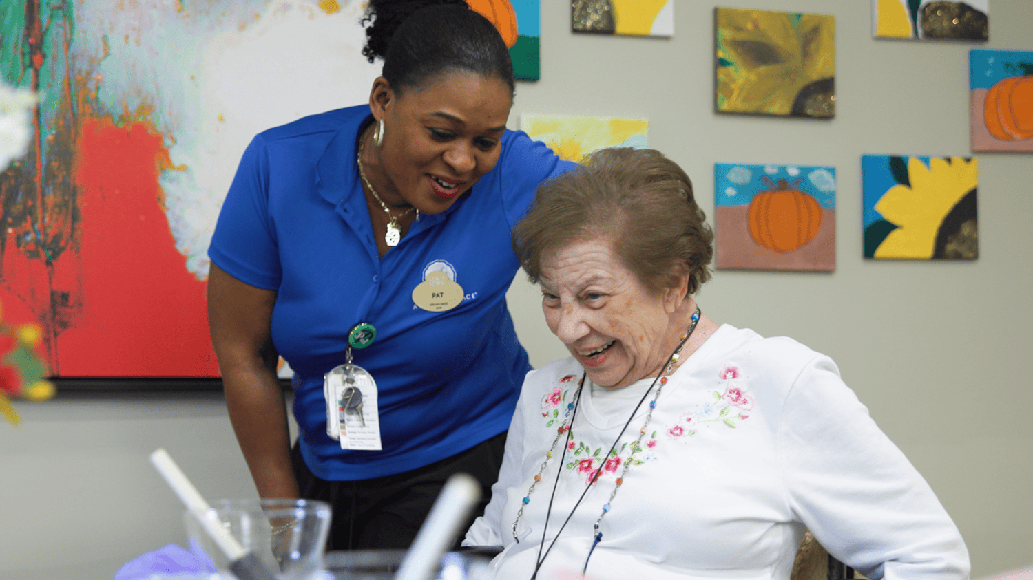 Arbor Terrace Hamilton Mill Resident and Staff Member Smiling