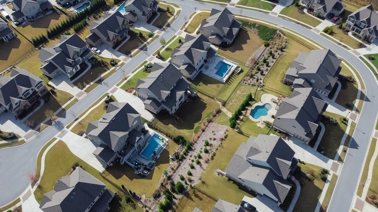 An aerial view of lakeside neighborhoods in Flowery Branch, a scenic community along Lake Lanier just a short drive from this senior living community near Hamilton Mill, GA.