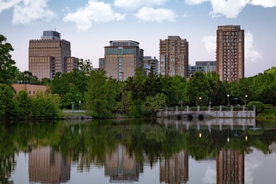 Reston Town Center's skyline and lakeside walkway offer shopping, dining, and entertainment just minutes from Arbor Terrace Herndon, providing senior living near Reston Town Center within this vibrant senior living Herndon Virginia community.