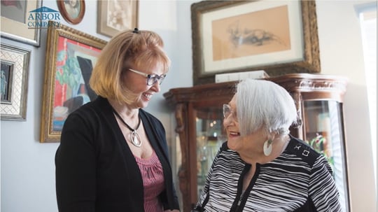 Senior lady smiling at her daughter