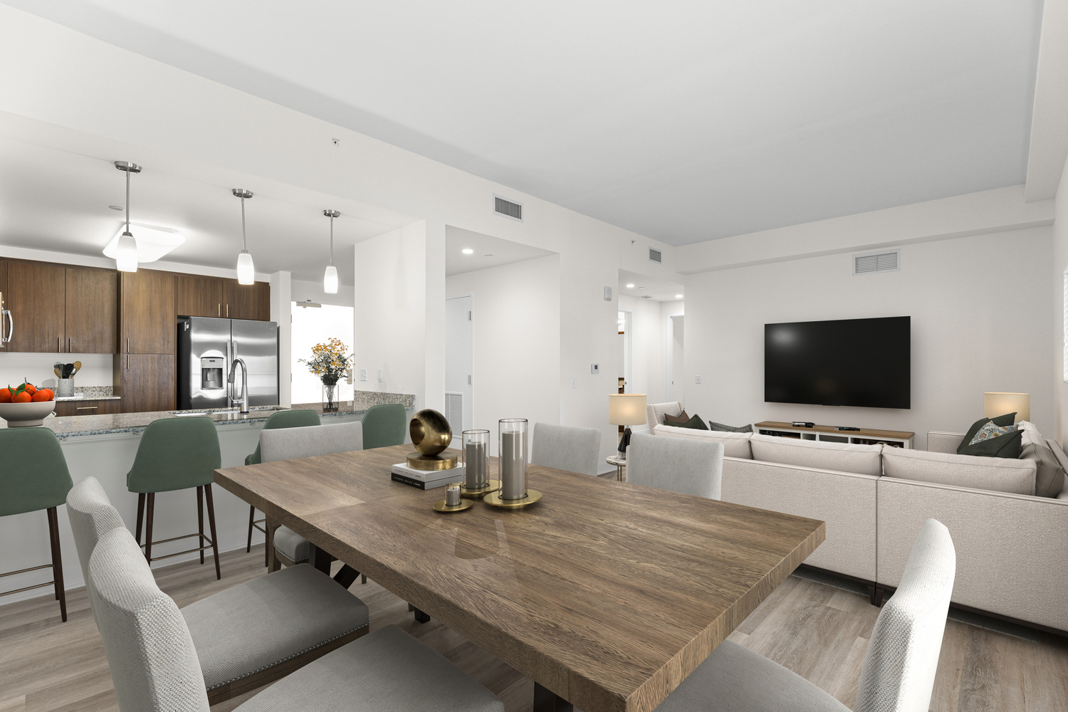 A large eat-in kitchen and living room in an apartment at The Arbor at Lake Worth.
