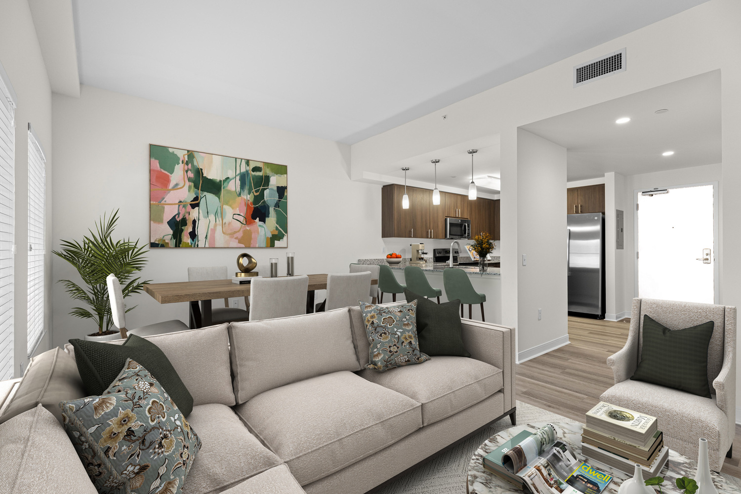 A spacious living room, an eat-in kitchen, in an apartment at The Arbor at Lake Worth.
