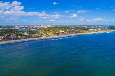 An aerial view of Boynton Beach's coastline, a nearby community offering coastal convenience for families visiting this senior living community in Lake Worth, FL.