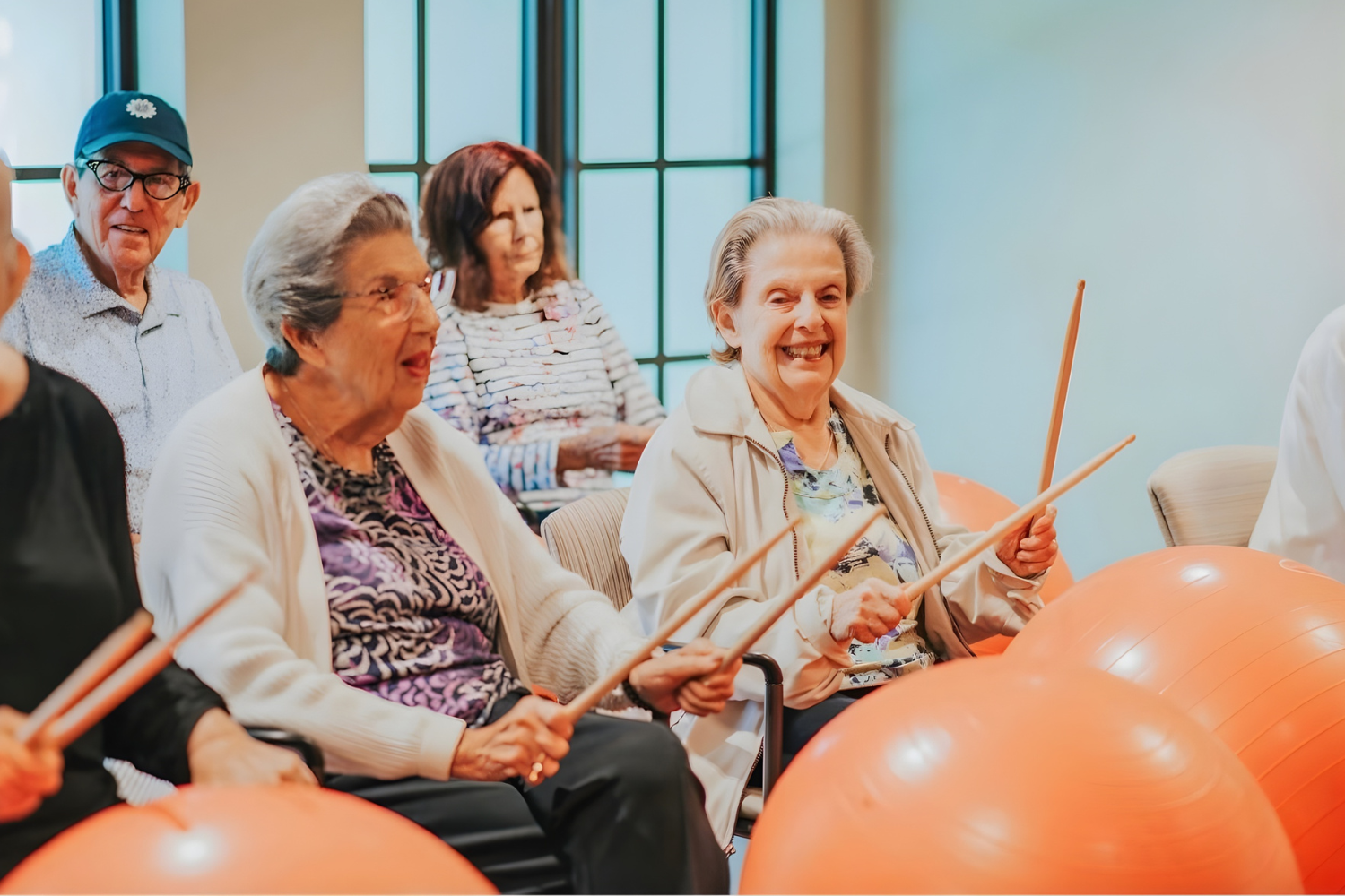 Senior residents in drum cardio class