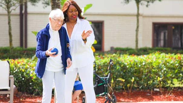 Residents and staff members playing a game outside 