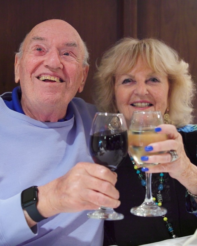 A senior couple enjoying their drinks