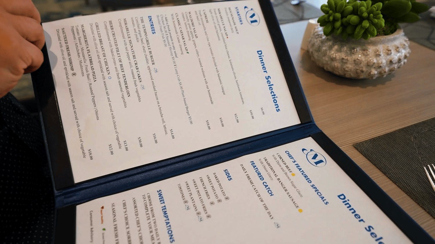 A close-up of a dining menu at Mirabelle senior living in Miami, FL, showcasing thoughtfully curated meal options available to residents of this assisted living community.