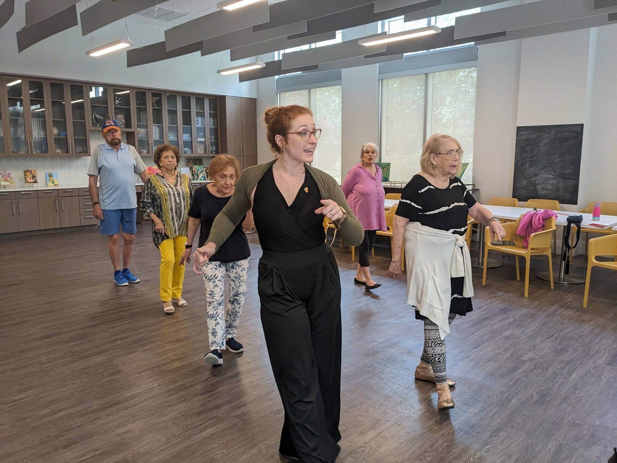 Mirabelle_Instructor teaches residents how to dance