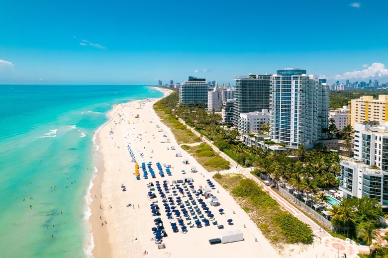 A stunning aerial view of South Miami's coastline and vibrant urban neighborhood, just minutes from this assisted living community in South Miami, offering a familiar and walkable city setting.