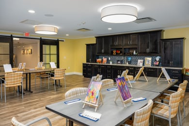 a space for arts and crafts  with tables and chairs in Arbor Terrace Monmouth