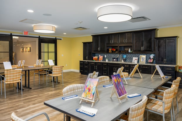 a space for arts and crafts  with tables and chairs in Arbor Terrace Monmouth