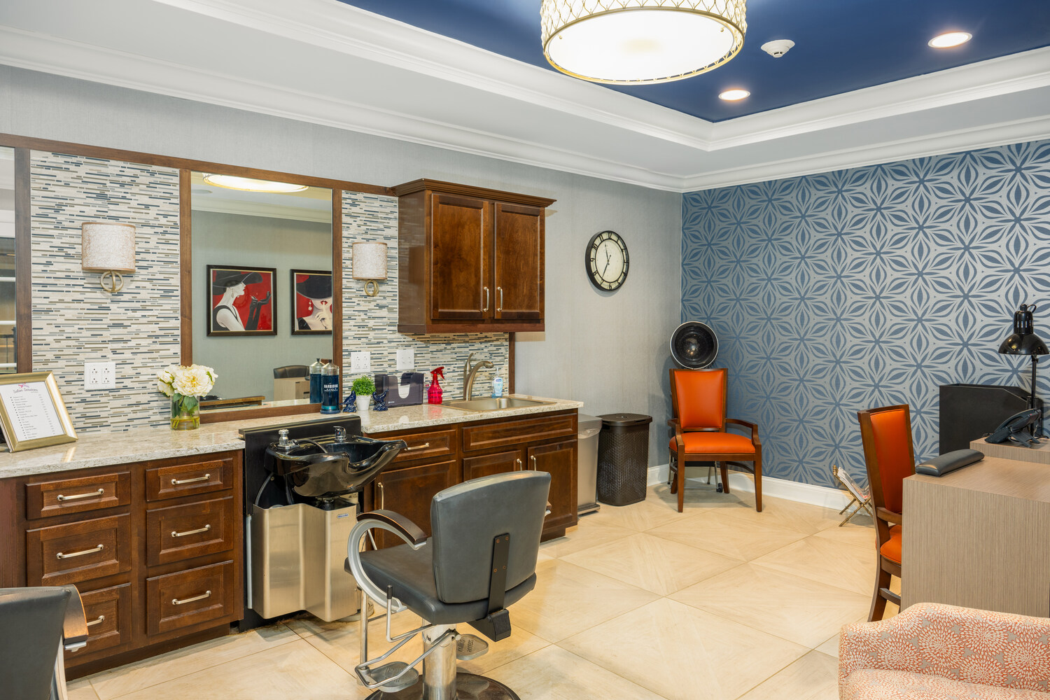 salon area with sinks and hair cut/nail stations for self-care treatments in Arbor Terrace Monmouth