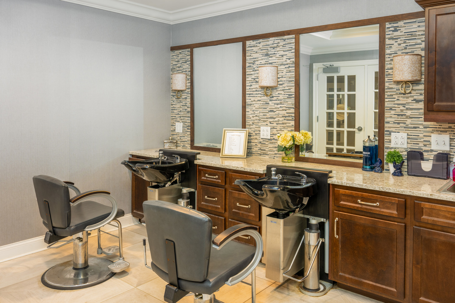 salon with hair salon chairs and stations in Arbor Terrace Monmouth
