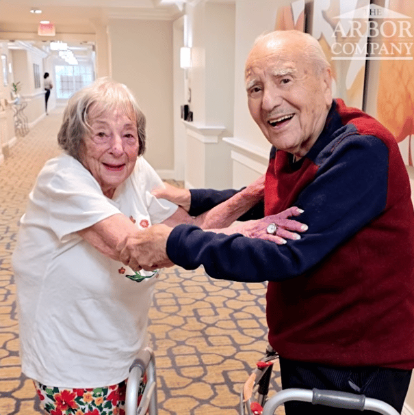 Two senior residents dancing at Arbor Terrace Monmouth.