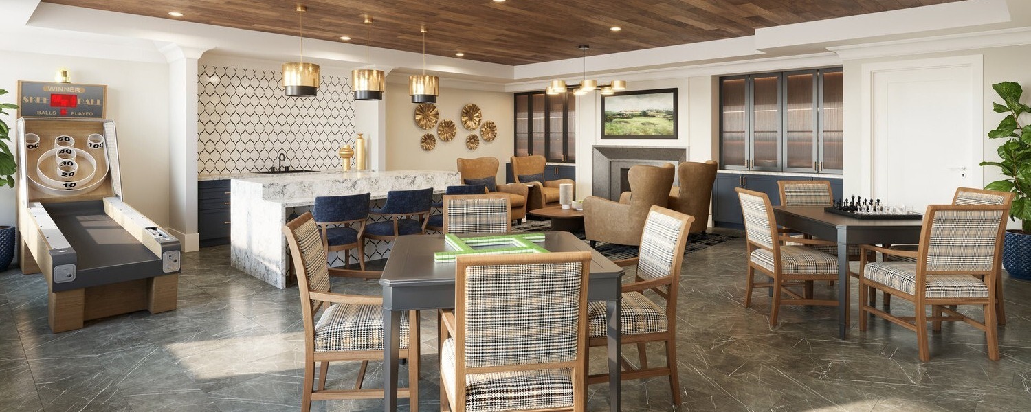 A spacious lounge at Arbor Terrace Montgomery features a shuffleboard game, bar seating, and comfortable dining tables, offering inviting spaces for socializing in this Skillman NJ senior living community.