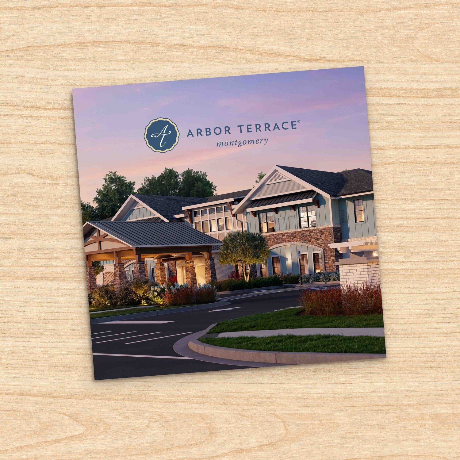 Marketing brochure for Arbor Terrace Montgomery senior living community, featuring a rendering of a two-story building with stone accents, gray siding, and a covered entrance, set against a sunset sky