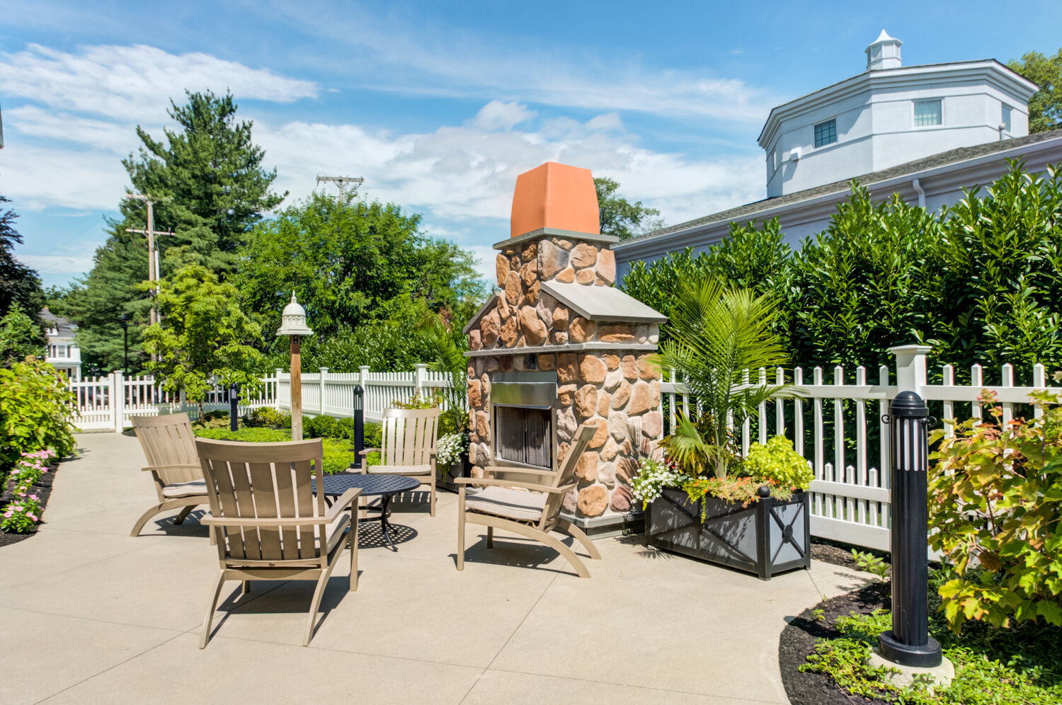 Outdoor patio at Arbor Terrace Morris Plains, a senior living community in New Jersey, featuring comfortable seating and a cozy atmosphere for residents to enjoy the outdoors.