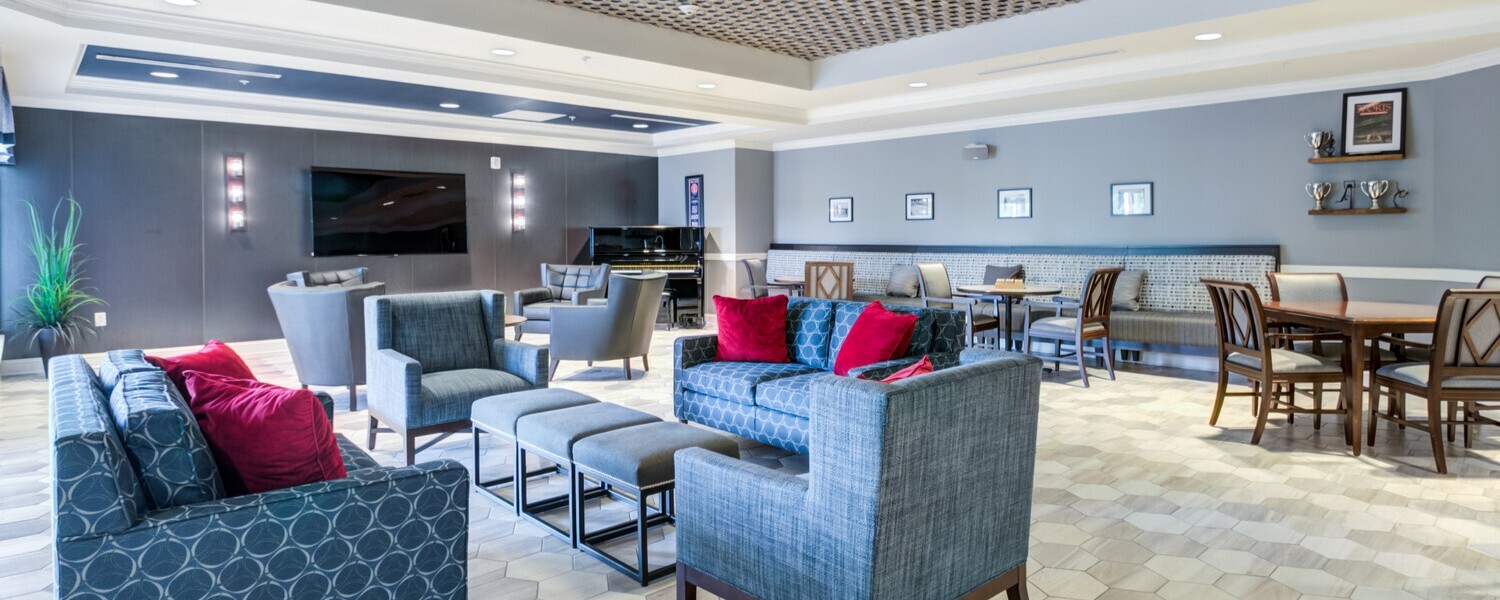 Modern common area at Arbor Terrace Morris Plains, a senior living community in Morris Plains, NJ, offering comfortable seating and vibrant decor for residents to relax and socialize.