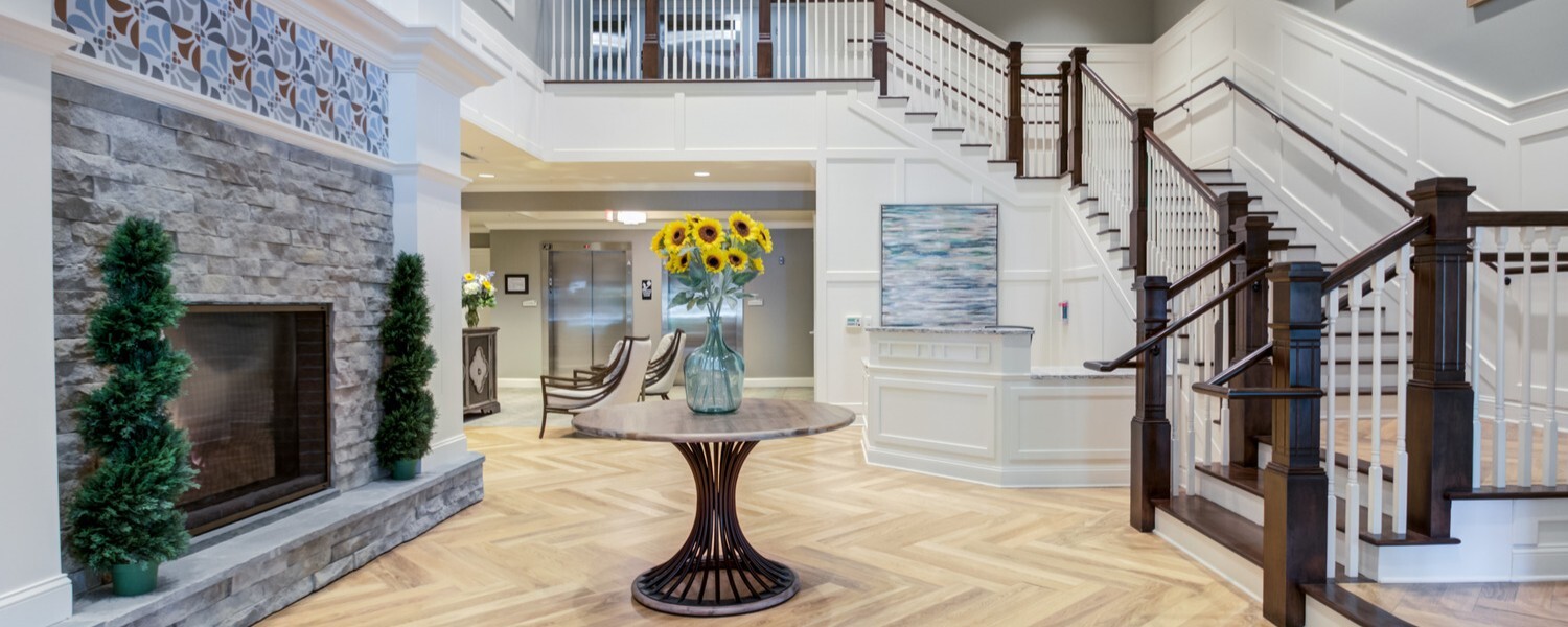 Beautiful lobby space at Arbor Terrace Morris Plains, a senior living community in New Jersey, with stylish decor, natural light, and a welcoming entry point for residents and visitors