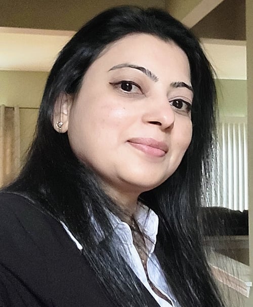Headshot of Bijal, a team member at Arbor Terrace Morris Plains, with long black hair and a confident, professional smile.