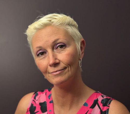 Headshot of Karen Bowman, a team member at Arbor Terrace Morris Plains, with platinum blonde hair and a thoughtful expression.