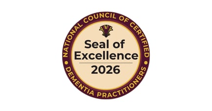 A round award seal in deep burgundy and gold with a cream center and a gold emblem at the top, honoring national recognition for excellence in memory care Mount Laurel NJ and person-centered memory care in Burlington County.