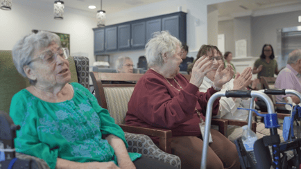 three senior ladies enjoying music